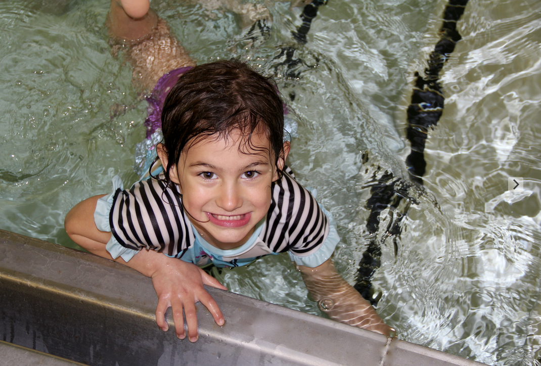 Girl swims in pool 